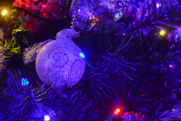 Obraz na płótnie Canvas Christmas tree decorated with lights and ornaments