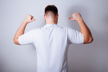man point on his back dressed white t-shirt
