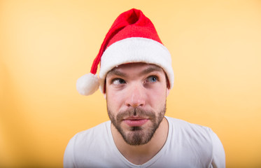 Man santa with cunning face on orange background