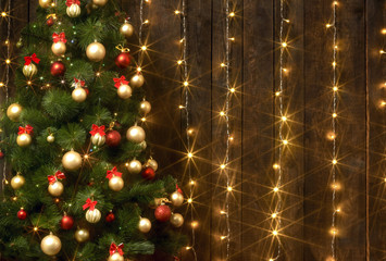 abstract wooden background with christmas tree and lights, classic dark interior backdrop, copy space for text, winter holiday concept