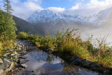 misty morning view in wet mountain area in slovakian tatra. tourist hiking trail