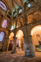 Obraz premium Different lights and colours of stained glass in Saint-Remi abbey interoir design, Reims, France