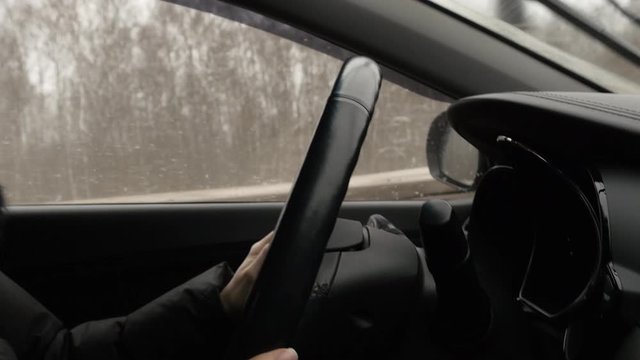 Woman With Steering Whell Driving In Winter Day
