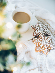 Cozy home Christmas decoration with a cup of coffee, gingerbread