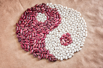 Yin Yan symbol of grain beans haricot red white on paper