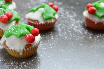 Cupcakes with holly decoration