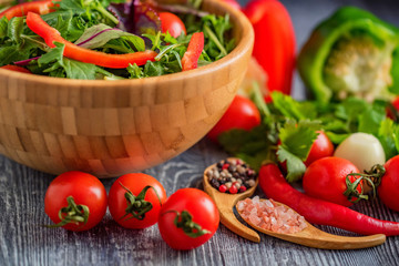 Fresh rustic vegetable salad on rustic background