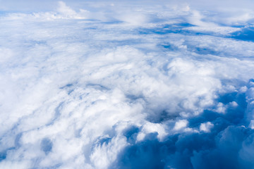 Fototapeta na wymiar Fluffy White Clouds from Above. clouds and sky