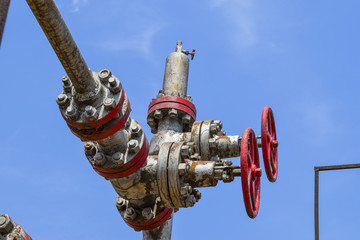 Oil well wellhead equipment. Hand valve with handwheel for opening and closing the flow line.