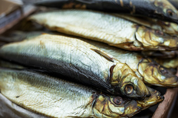 Smoked fish in street market shelf
