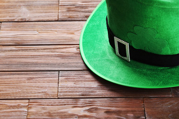 Green St. Patrick's day hat on brown wooden table