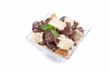 Tasty halva in bowl isolated on white background