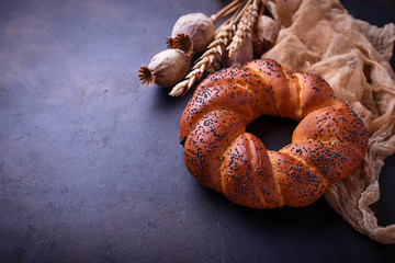 Sweet bun with poppy seeds.