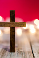 Holy Christian Wooden Cross on an Abstract Red Background