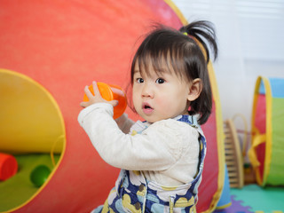baby girl play toy at home