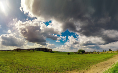 Panoramic view of rural landscape, sunny spring day