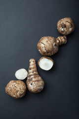Organic Jerusalem artichoke isolated on a black background.