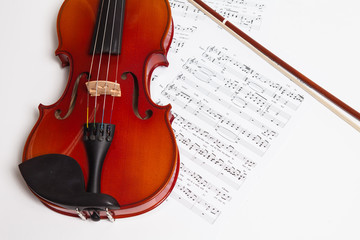Violin, bow and music sheets 