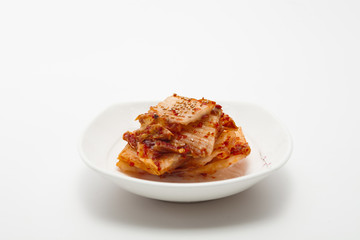 Kimchi on white dish isolated 