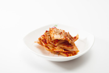 Kimchi on white dish isolated 