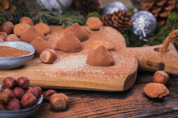 Homemade chocolate truffles, nuts, almonds and cocoa powder