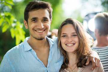 During a party, Portrait of a young couple looking at camera