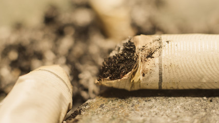 Burned cigarette butt, just the end of the cigarette after smoked
