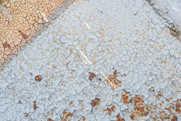 surface of rusty iron with remnants of old paint, chipped paint, grey texture, background