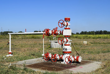 Well for oil and gas production. Oil well wellhead equipment. Oil production