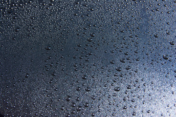 Water drop on black background.Water drop on black texture