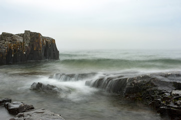 Waves swelling into the rocks