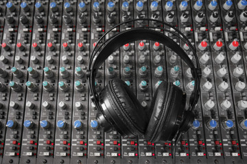 Headphones on mixer in radio station
