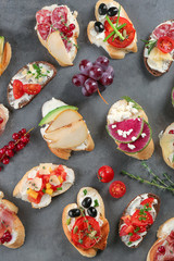 Delicious bruschettas on grey background