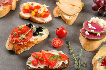 Delicious bruschettas on grey background