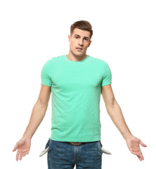 Obraz premium Man showing empty pockets on white background