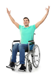 Obraz premium Young man in wheelchair on white background