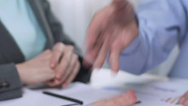 Handshake after negotiations, positive lending decision, property investor