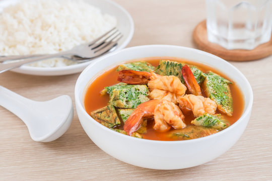 Acacia leave omelet and shrimp in spicy sour soup and rice on plate,  Thai food
