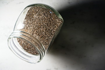 Isolated Chia Seeds on White Marble
