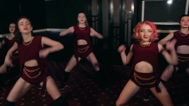 Five beautiful and sexy girls dance twerking at a nightclub. Group of hot girls dancing twerk.