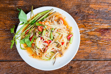 Thai food Papaya salad Spicy flavor On the old wood table