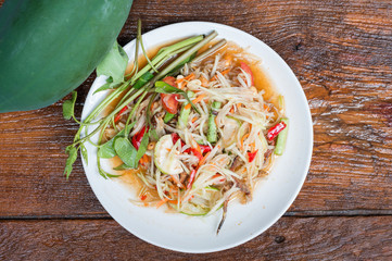 Thai food Papaya salad Spicy flavor On the old wood table