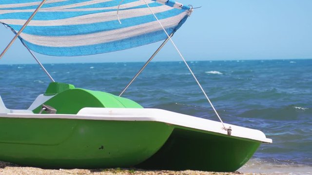 Catamaran standing on the sandy beach. Slow motion. 3840x2160