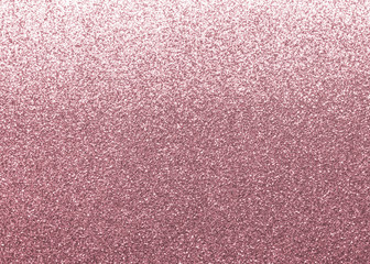 Rose gold pink glitter texture background shiny metallic wrapping paper in purple color with...