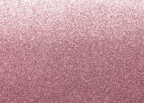 Rose gold pink glitter texture background shiny metallic wrapping paper in purple color with reflective metal surface for Valentine’s day holiday decoration wallpaper backdrop design element  
