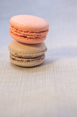 Delicious cake macaroons on light background, close up