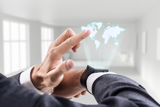 Hand point on virtual map from his smartwatch. - Powered by Adobe