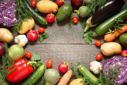 Assortment of vegetables pepper, baclaran, tomatoes, zucchini, carrots on wooden boards