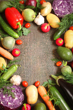 Assortment of vegetables pepper, baclaran, tomatoes, zucchini, carrots on wooden boards
