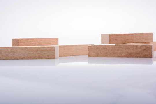 Wooden domino blocks on white background